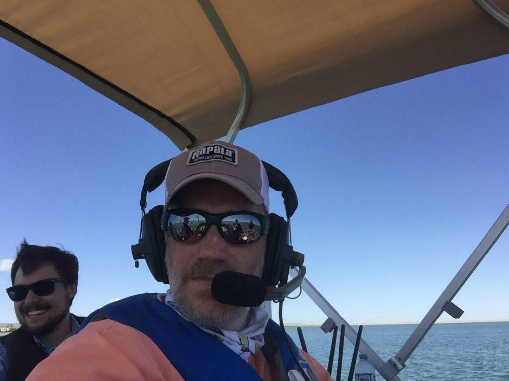 Rob broadcasting from a boat.